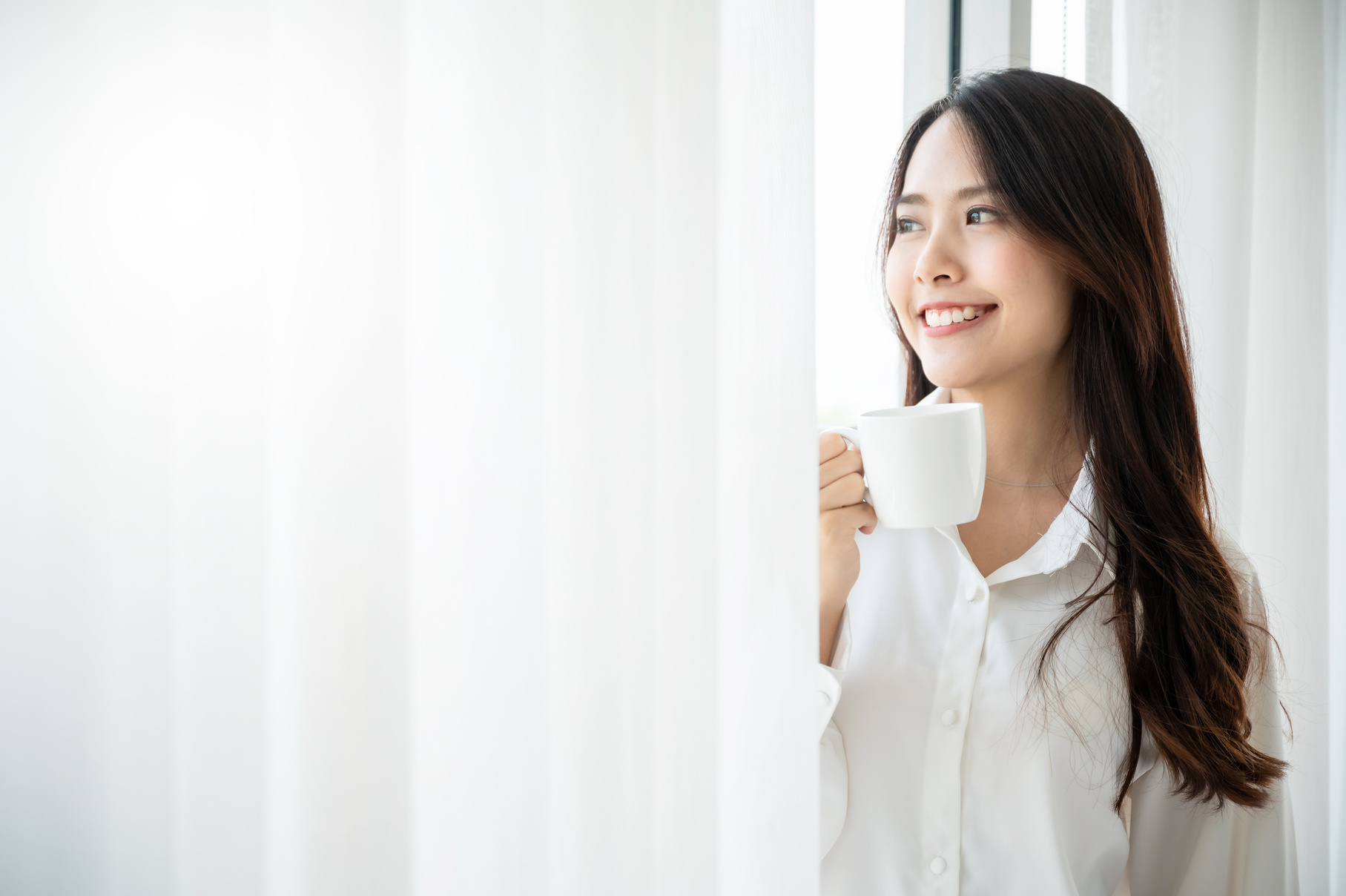 Woman Drinks Coffee in the Morning