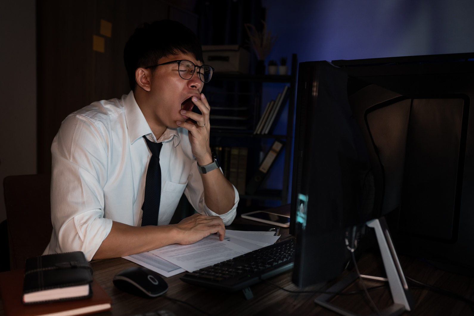 Tired Businessman Working Late at Night